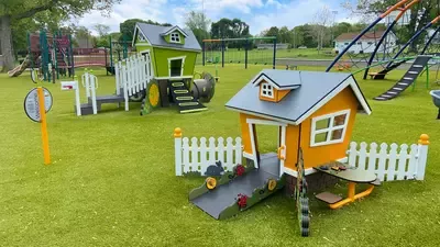 The playground at James Park has a variety of equipment for children of all ages to climb on, swing on, crawl through, slide down, spin around, and hide in