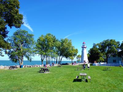 Looking at the park lawn with the lighthouse in the distance