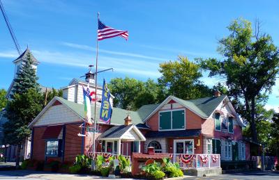A shop with an American Flag on a flag pole