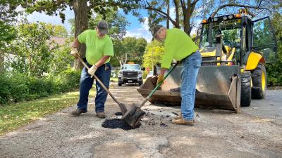 Village maintenance crew performing seasonal pothole patching